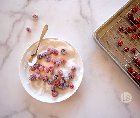 sugared cranberries on plate/cooling rack