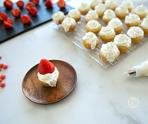 sugar cookie cups with a strawberry "hat"