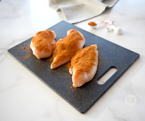 shredded chicken on cutting board