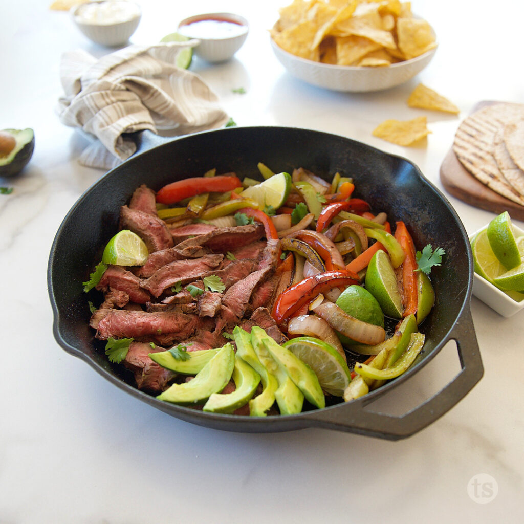 steak fajitas, loaded with sweet bell peppers, onions, spices and a hint of fresh lime