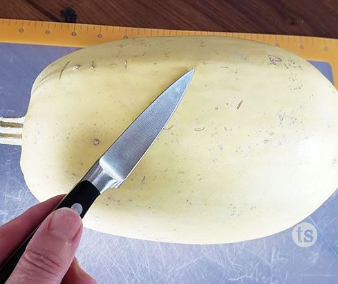 Spaghetti Squash on cutting board with knife