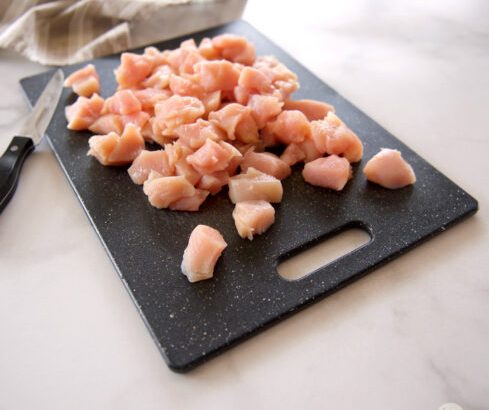 Diced chicken on cutting board